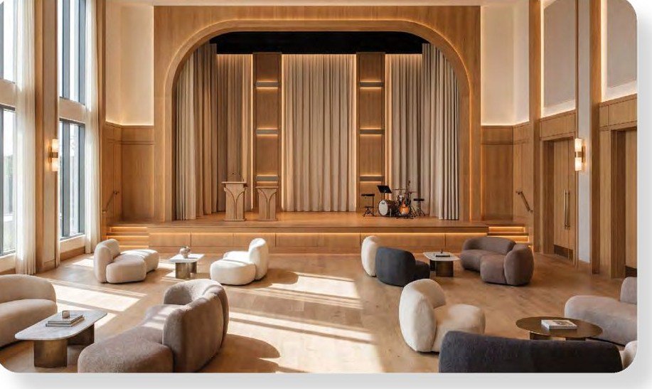 Tata Orbis double-height clubhouse lounge with performance stage